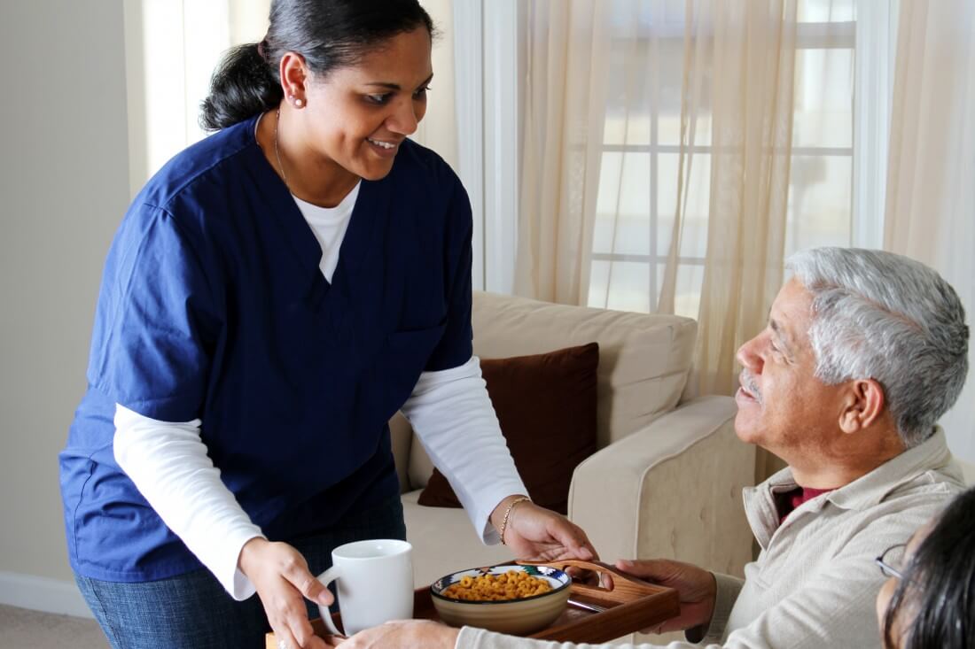 Senior Resident and Caregiver Interacting